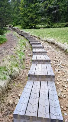 a row of stepping stones on a dirt road at Apartma Jurček Rogla in Rakovec