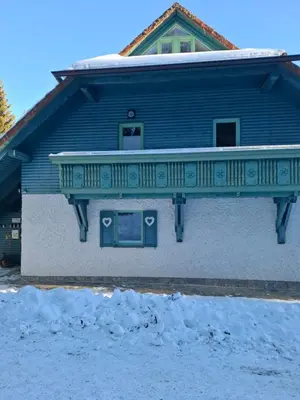 a balcony on a house with snow on the ground at Apartma Jurček Rogla in Rakovec