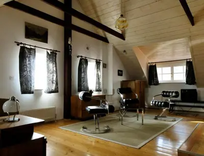 a room with chairs and a hair salon at Apartment Tagrajska in Ljubljana