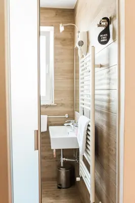 a bathroom with a sink and a mirror at Hotel Penzion Kobala in Tolmin