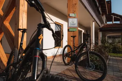 a group of bikes parked outside of a building at Hotel Penzion Kobala in Tolmin