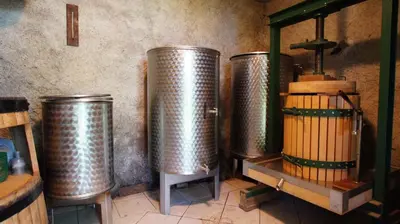 three metal tanks are lined up against a wall at Holiday home in Semic - Kranjska (Krain) 26078 in Semič