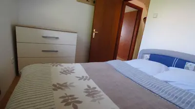 a small bedroom with a bed and a dresser at Holiday home in Semic - Kranjska (Krain) 26078 in Semič