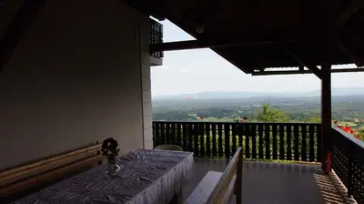a balcony with a table and a view of the valley at Holiday home in Semic - Kranjska (Krain) 26078 in Semič