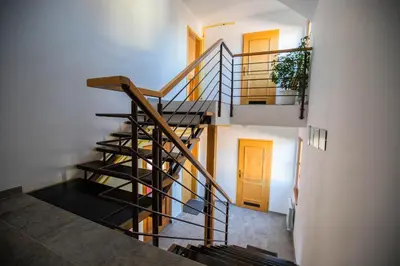 a spiral staircase in a house with a door at Apartment Jurič in Maribor