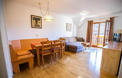 a living room with a table and a couch at Apartment Jurič in Maribor