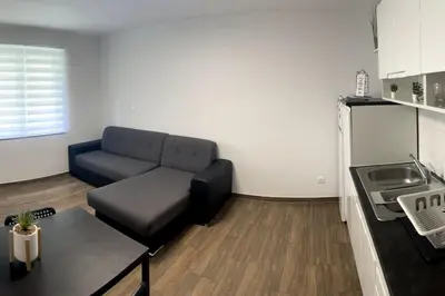 a living room with a couch and a table at Apartment in Maribor in Maribor