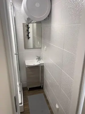 a bathroom with a sink and a mirror at Apartment in Maribor in Maribor