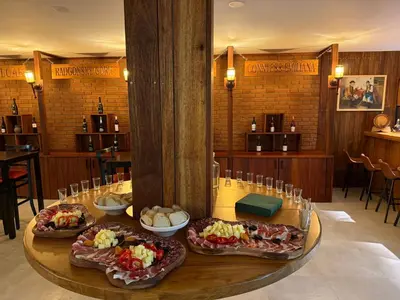 three plates of food on a table in a restaurant at Rooms at Podlipje Estate in Tešanovci