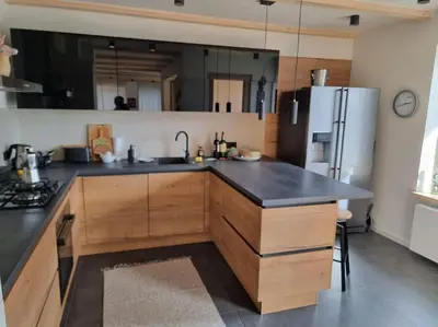 a kitchen with a sink and a refrigerator at Comfy mountain nest in Mojstrana
