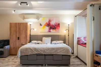 a bedroom with a bed with two pillows at Apartma in wellness Čista fantazija in Velika Polana