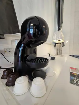 a black coffee maker sitting on a kitchen counter at Ljubljana Park Apartments Bolero in Ljubljana