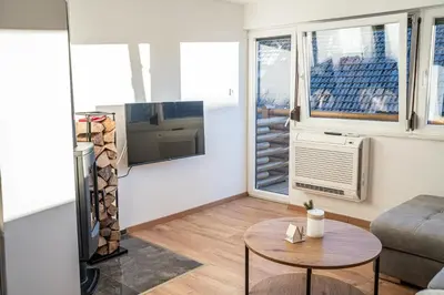 a living room with a couch and a table at Apartmaji Ježek Kope in Šmartno pri Slovenj Gradcu