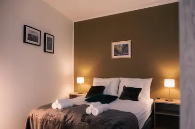 a bedroom with a bed with two pillows on it at Peak Haven apartments, Pohorje in Pohorje