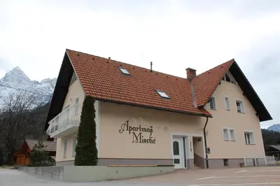 a building with a sign that reads durham music at Apartmaji Misotič in Gozd Martuljek