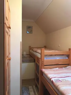 a bedroom with four bunk beds in a room at Apartmaji Misotič in Gozd Martuljek