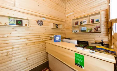 a log cabin with a cash register in a room at Apartments Brunarica in Moravske Toplice