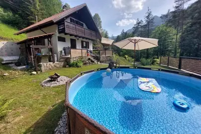a swimming pool in the yard of a house at Alpine House Naturalina - Happy Rentals in Slappe dʼIdria