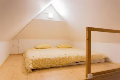 a bedroom with a bed in a attic at Alpine Spot in Kranjska Gora