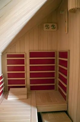 a sauna with two red panels on the walls at Holiday Home Razglednik in Logatec
