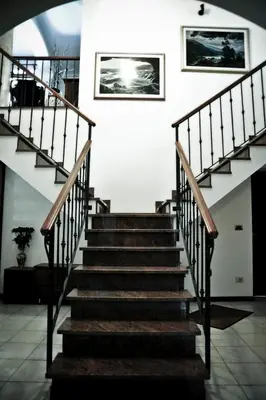 a staircase in a house with wooden steps at Rooms Leban in Šempas
