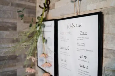 two framed menus on a wall with flowers at Countryside cottage with mountain view in Lukovica pri Domžalah