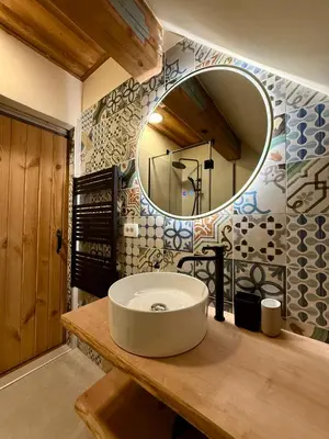 a bathroom with a sink and a mirror at Apartments Julijana in Kranjska Gora