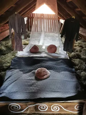 a bed in a tent with a shell on it at Hay barn unique experience Visole in Slovenska Bistrica