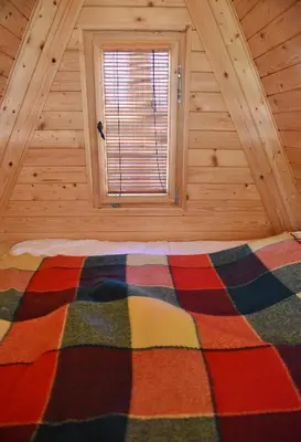 a bed in a room with a window at Luxury Wellnes Glamping Cottage - Salvus in Lendava