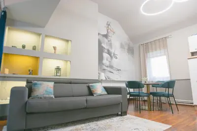 a living room with a couch and a table at BRIDGE apartments in Ljubljana