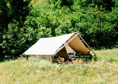 a tent in the middle of a field at Adrenaline Check Camping in Bovec