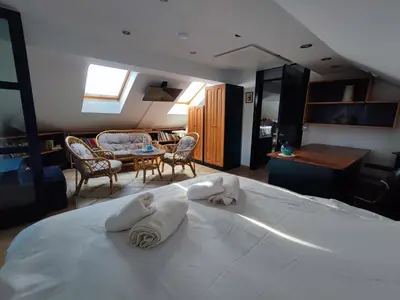 a hotel room with a bed with towels on it at Salvus Apartma - Sun & Moon in Lendava