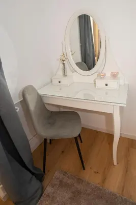 a white desk with a chair and a mirror at Central Elite Vista-with parking in Ljubljana