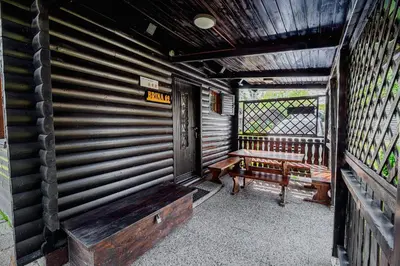 a porch with a wooden bench and a window at Holiday Home Brina 69 in Čatež ob Savi