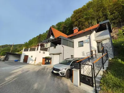 a car parked in front of a house at Deluxe House Maj in Brežice