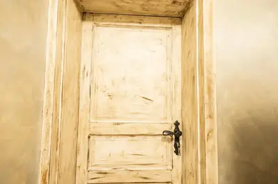 an old wooden door with a black handle at Apartments Bells of Ljubljana - 3 cosy apartment Private Free Parking in Ljubljana