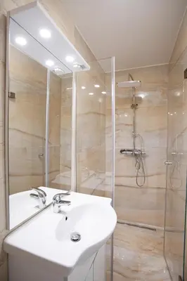 a bathroom with a sink and a shower at Apartments Bells of Ljubljana - 3 cosy apartment Private Free Parking in Ljubljana