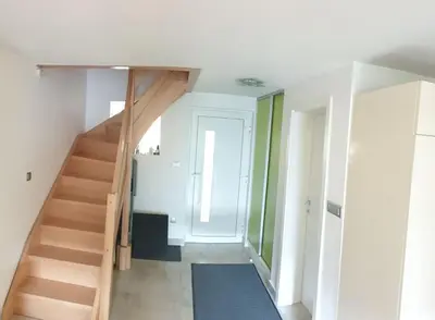 a room with a staircase and a hallway at moderno opremljena hiša z odmaknjeno lokacijo in Dolenjske Toplice