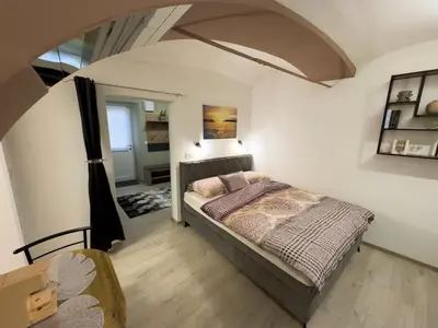 a bedroom with a bed in a room at Apartments Adamas in Celje