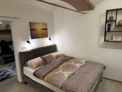 a bedroom with a bed in a room at Apartments Adamas in Celje