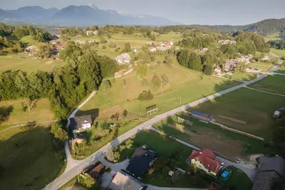an aerial view of a village with houses and a road at Studio Apartment Jož' in Spodnja Lipnica