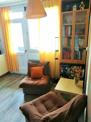 a living room with a couch and a table at Comfy and central with bikes in Bohinj