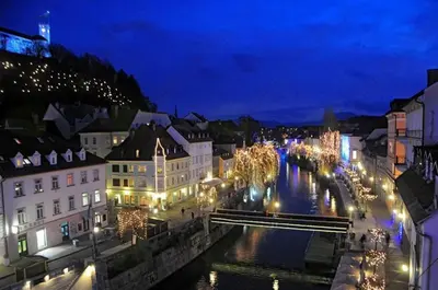 a view of a city at night with lights at Ljubljana apartment in Ljubljana