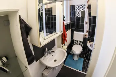 a small bathroom with a sink and a toilet at Ljubljana apartment in Ljubljana