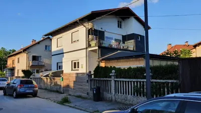 a house with a balcony on the side of it at Ljubljana apartment in Ljubljana