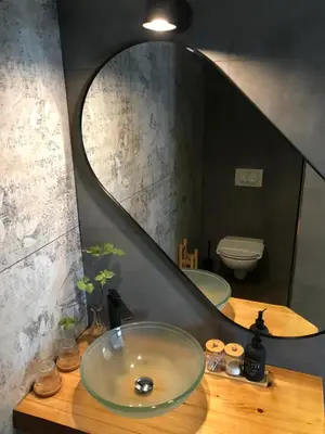a bathroom with a sink and a mirror at La Cubanita in Kojsko