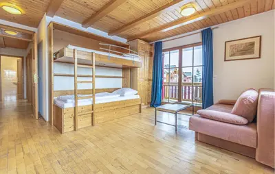 a room with a bunk bed and a couch at Stunning Apartment In Pohorje With Wifi in Pohorje