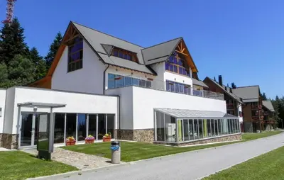 a large white building with a lot of windows at Awesome Apartment In Pohorje With Wifi in Pohorje