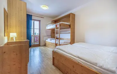 a bedroom with two bunk beds and a window at Awesome Apartment In Pohorje With Wifi in Pohorje