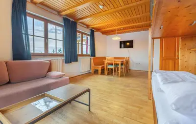 a living room with a couch and a table at 1 Bedroom Gorgeous Apartment In Pohorje in Pohorje